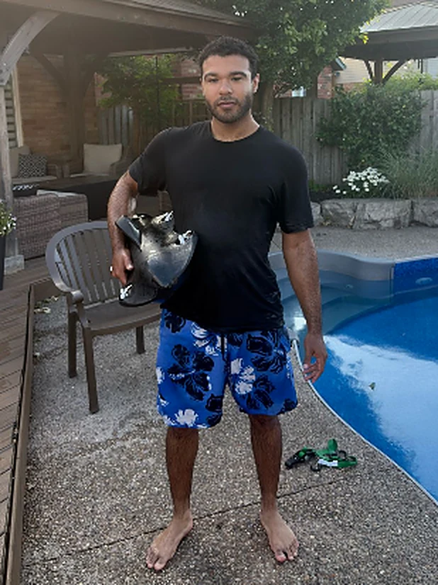 Vantage V0 carried under one arm after the pool test